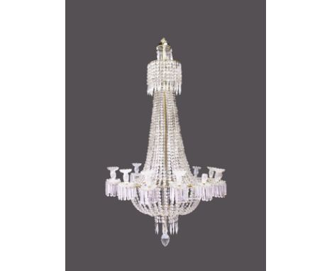 A SUPERB LARGE CUT CRYSTAL CHANDELIER, with rows of prisms and fourteen candle sconces with prism drops. Overall length 5ft l