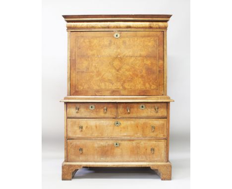 A QUEEN ANNE WALNUT ESCRITOIRE, with cushion drawer above a fall front, fitted interior over a base with two short and two lo