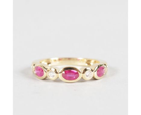 A RUBY AND DIAMOND HALF HOOP RING set in 18ct yellow gold.
