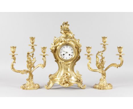 A LOUIS XVI ORMOLU THREE PIECE CLOCK GARNITURE, the clock with acanthus scrolls and motifs, with eight-day movement, 17ins hi