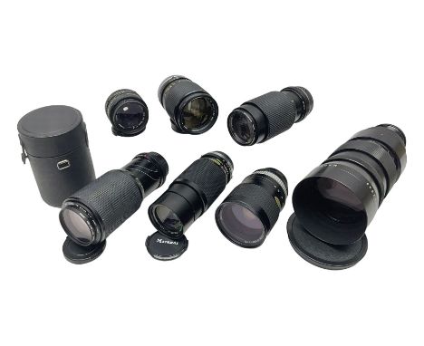 Seven camera lenses, including 'Pentacon 4/300' lens, serial no 8613038, 'Hoya HMC Zoom 28-85mm 1:4' lens serial no 215421, M