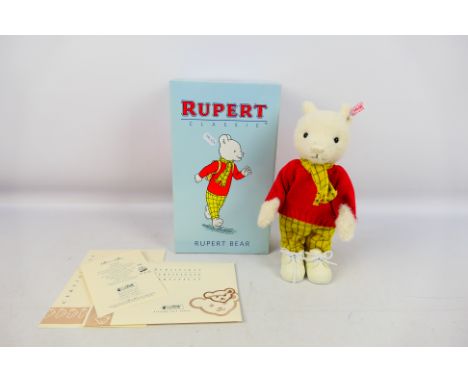 Steiff - A boxed Steiff Limited Edition Rupert Bear. The 28cms high, odour free, white bear with Steiff button and white labe