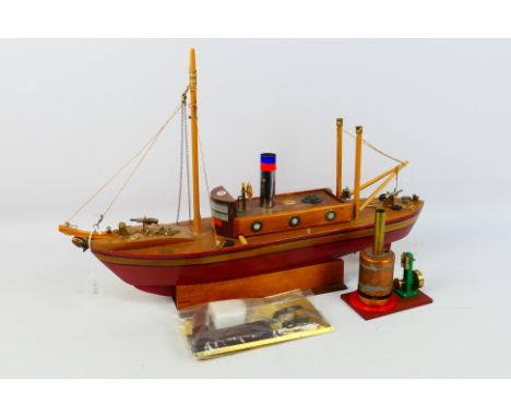 Model Boat - A probably scratch built wooden boat measuring 63 cm x 41 x 15 on stand. It has a battery motor inside which is 