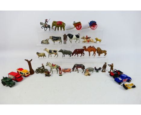 Britains - Johillco - Matchbox - A collection of cast metal animals and figures including an elephant, a camel, a lion, 2 x c