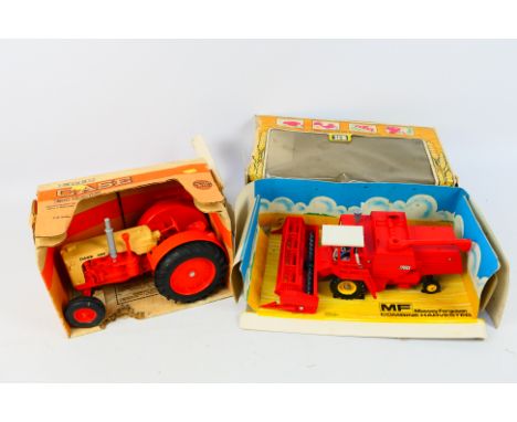 Britains - Ertl - Two boxed diecast farm vehicles. Lot consists of Britains #9570 Combine Harvester; with Ert; 1:16 scale #28