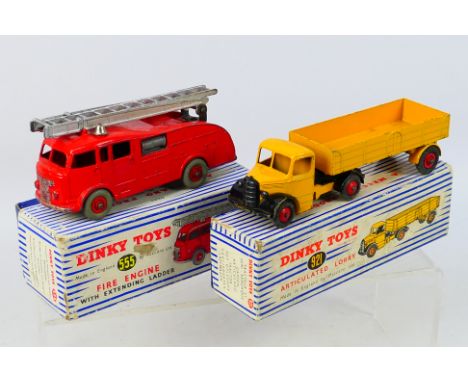 Dinky - 2 x boxed models, a Bedford Articulated Lorry # 921 and a Commer Fire Engine # 555. They show signs of play use and a