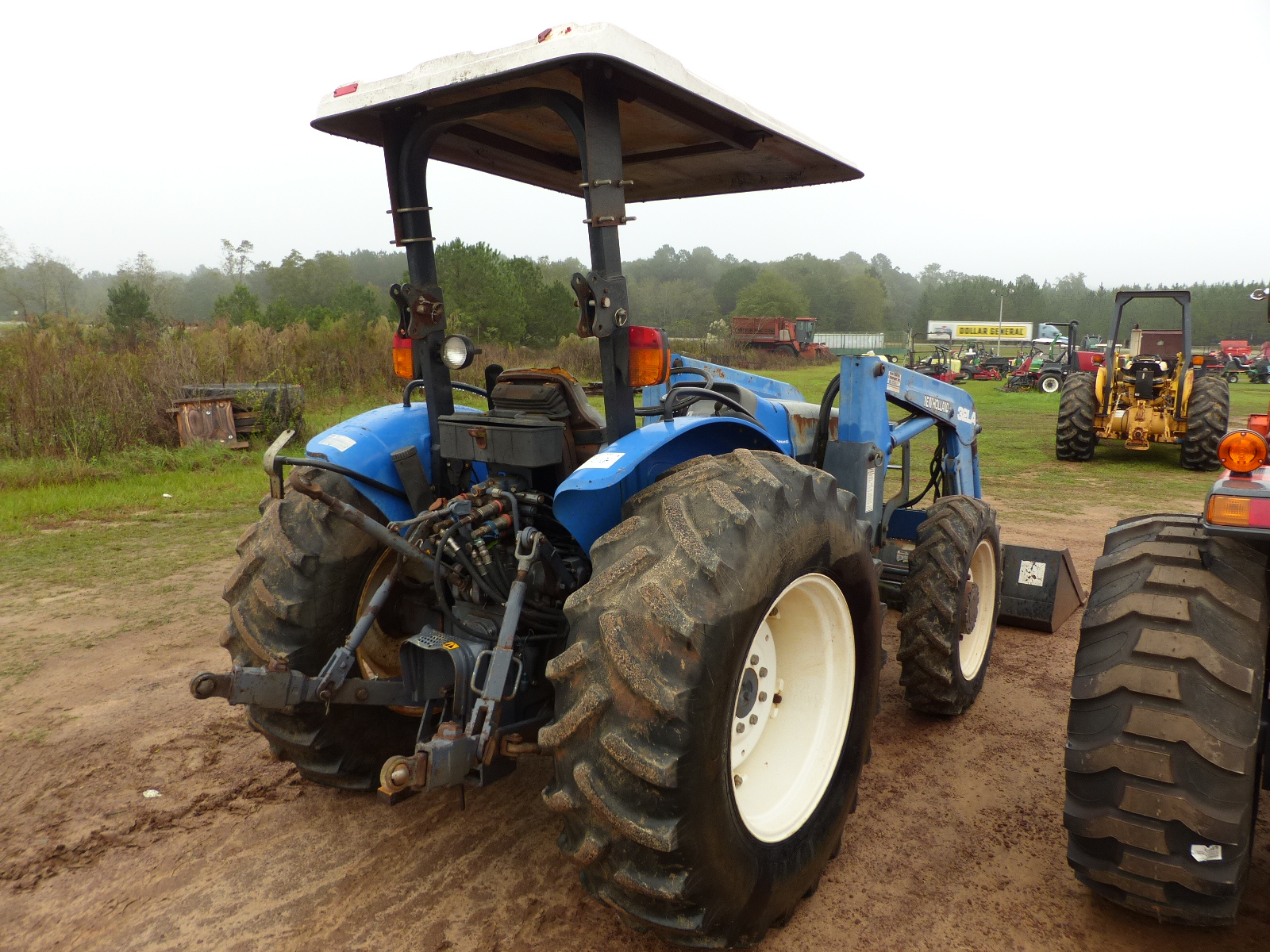 ID4680 NEW HOLLAND TN65 TRACTOR, CANOPY, 4WD, W/32LA LOADER AND