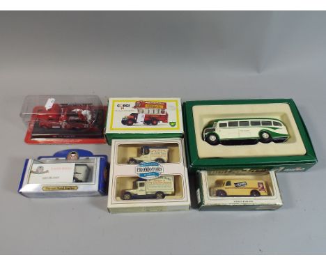 A Collection of Six Boxed Diecast Models to Include Buses, Goods Vehicles, Fire Engine etc