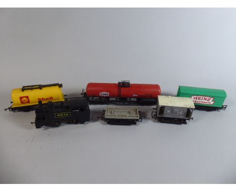 A Collection of Mixed OO Gauge Goods Trains to Comprise 0-4-0 Tank Engine No 6042 with a Flat Wagon, Heinz Baked Beans Wagon,