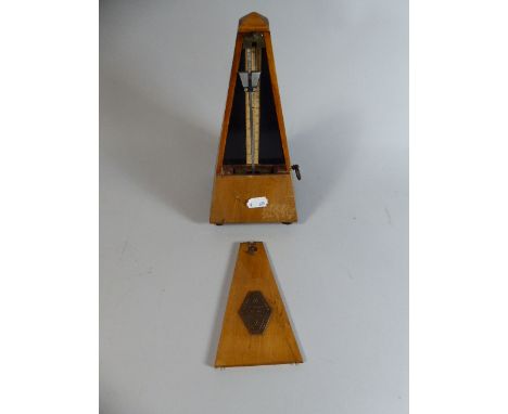A French Walnut Cased Metronome, 23cm high 