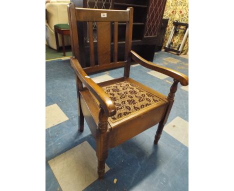 An Edwardian Oak Framed Commode Armchair 