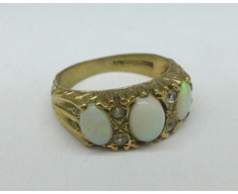 A 9ct gold and three stone opal ring, 3.5g, J