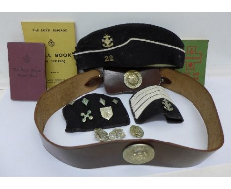 A Boys Brigade Drill Book, swagger stick, belt, badges, etc.