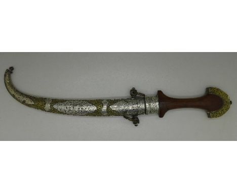 An Arabian dagger with brass and white metal mounted scabbard