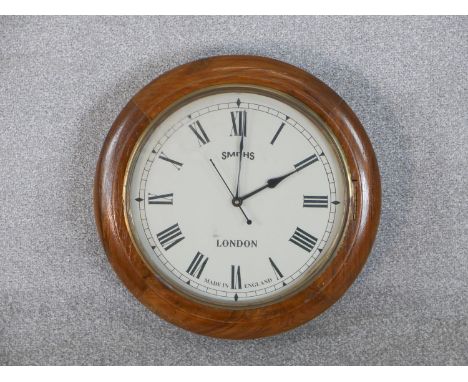 A Smiths London mahogany framed vintage wall clock. Diam.40cm 