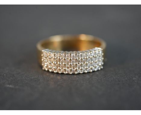 A 9 carat yellow gold diamond set dress ring, set with fifty two round eight cut diamonds with a combined approximate carat w