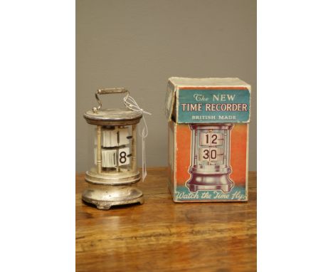 'Ever Ready Chronos' ticket flap clock, glazed cylindrical form with carrying handle, with original packaging, H12.5cm (exclu