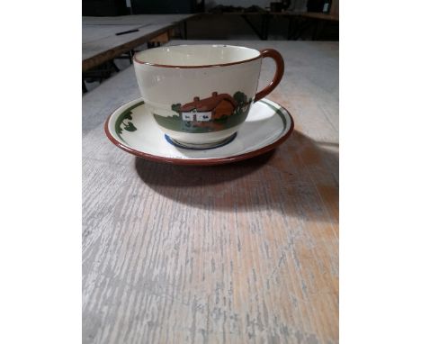  Sale Item:    DARTMOUTH POTTERY CUP &amp; SAUCER   Vat Status:   No Vat   Buyers Premium:  This lot is subject to a Buyers P