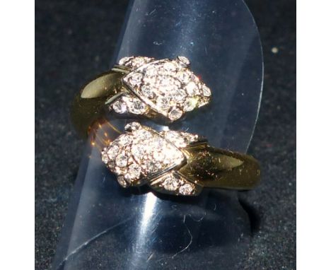 A vintage yellow metal double headed snake ring stamped '750', set with 36 diamonds, 8.2 gm