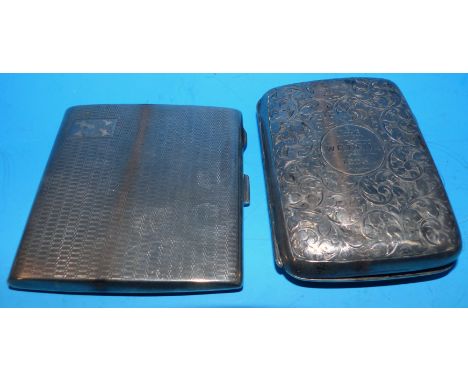 A chased monogrammed cigarette case, Birmingham 1897; an engine turned cigarette case, Birmingham 1927, 6 oz.