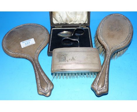 A silver back monogrammed beaded dressing table hand mirror and brush, Sheffield 1918; a gent's hairbrush; a silver plated sp