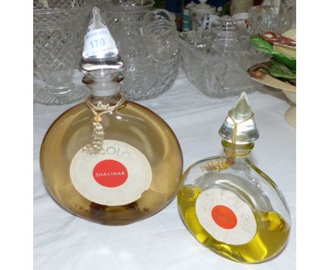 Two vintage factice bottles "Shalimar" by Guerlain NY, and "No 90" by Guerlain NY, complete with cord and seal