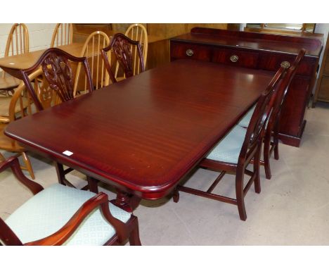 A Regency style mahogany dining suite comprising twin pedestal table, 6 (4 + 2) shield back chairs, sideboard of 3 cupboards 