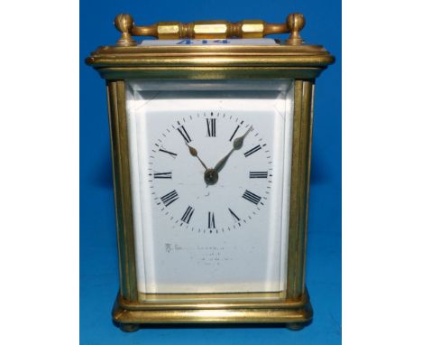 A small brass carriage clock, with 8 day movement striking on bell, height 3½"