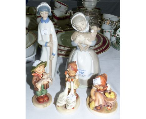 A Nao figure; a similar figure; 3 Hummel figures of children