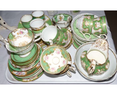 A Minton's "Rockingham" green, gilt and floral part tea service; a similar tea service; etc.