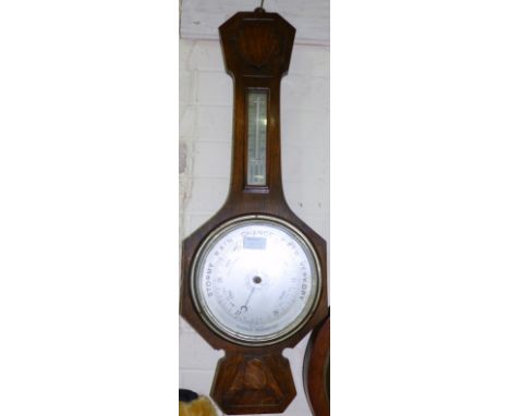 An early 20th century oak aneroid barometer with thermometer