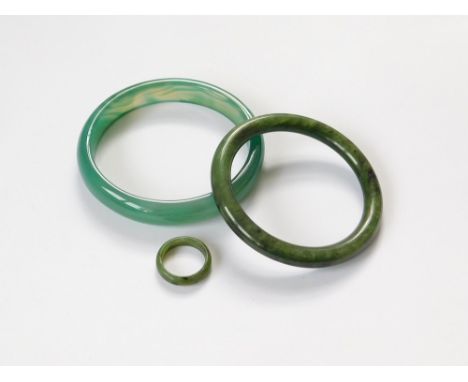 JADEITE ETC. A green jadeite bangle & similar ring. Also, one other marbled green bangle, possibly glass.  Please note that a
