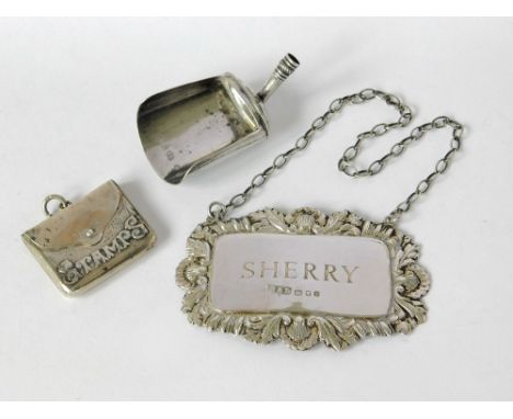 STAMP CASE ETC. A silver 'stamps' case, a silver caddy spoon (lacks handle) & a modern silver spirit label for sherry. Please