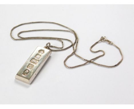 SILVER INGOT. A silver ingot on silver box link chain.  Please note that all items in this auction are previously owned & are