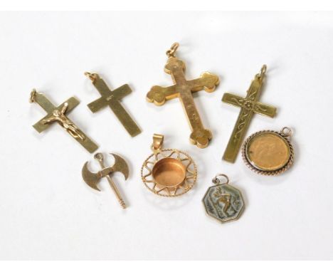 GOLD CROSSES ETC. Three 9ct. gold crosses, a 9ct. gold axe pendant & three other gold pieces. Also, a silver gilt engraved cr