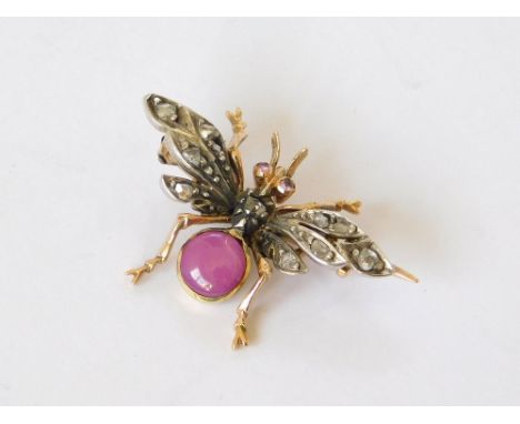 BEE BROOCH. A 19th century yellow metal bee brooch, the body set a star ruby, the wings set with old cut diamonds & the eyes,