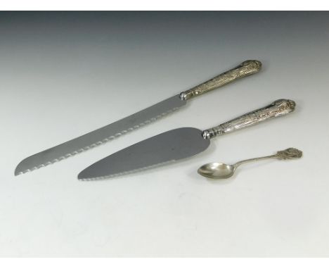 SILVER FLATWARE. A silver mounted bread knife, a silver mounted pie server & a Bowling teaspoon.  Please note that all items 