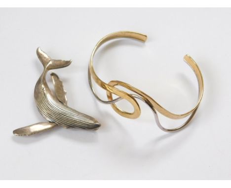 SILVER BANGLE ETC. A silver & silver gilt torque bangle & a silver whale brooch/pendant by Steve Kenhead, signed.  Please not