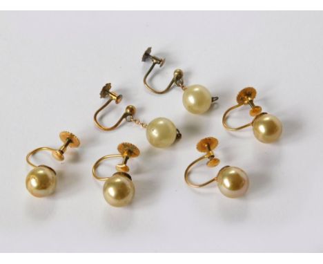 GOLD EARRINGS. Three pairs of 9ct. gold mounted faux pearl earrings. All with screw fittings.  Please note that all items in 