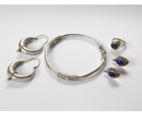 SILVER EARRINGS ETC. A pair of Indian silver & lapis stud earrings, a Mexican silver & obsidian set dress ring, an Indian whi