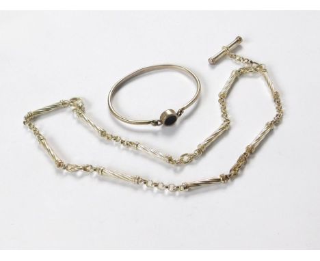 SILVER NECKLACE ETC. A modern silver T-bar necklace & a silver & black onyx bangle.  Please note that all items in this aucti