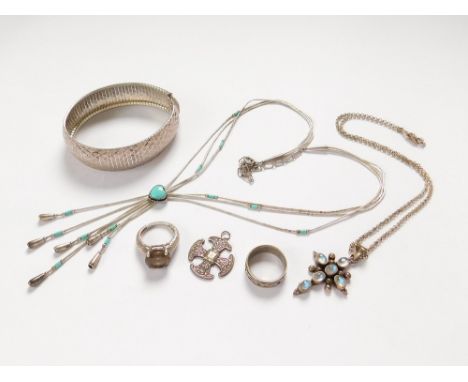 SILVER BRACELET ETC. An Italian flexible silver bangle, a silver & turquoise necklace, a smoky quartz dress ring, a silver Ce