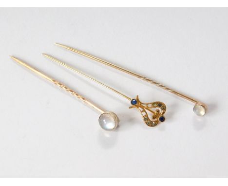 STICK PINS. Two moonstone stick pins & one other paste set stick pin.  Please note that all items in this auction are previou