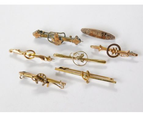 GOLD BROOCHES ETC. A 15ct. gold bar brooch with half pearl horseshoe & riding crop (approx. 2.4g). Also, four various 9ct. go