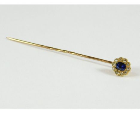 STICK PIN. A sapphire & old cut diamond cluster stick pin, the oval central sapphire of good colour. (Head unscrews from shaf