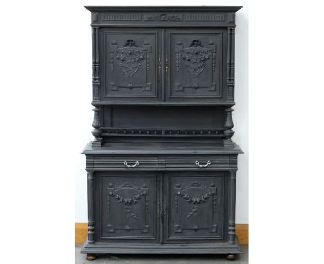 A Flemish carved oak buffet a deux corps, late 19th c, painted at later date, 219cm h; 53 x 138cm  Shrinkage cracks across to