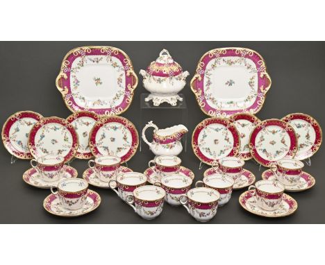 An English porcelain tea and coffee service, c1850-60, printed and painted with festoons beneath claret and gilt border, crea