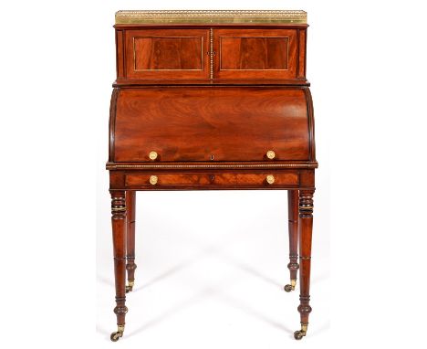 A George IV brass mounted mahogany cylinder bureau, W Priest London, the galleried superstructure with marble slab and two fi