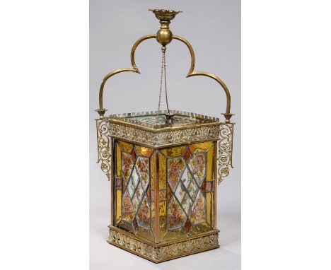 A late Victorian brass gas hall lantern, the leaded glass lights painted with flowers in 'hammered' amber glass surround and 