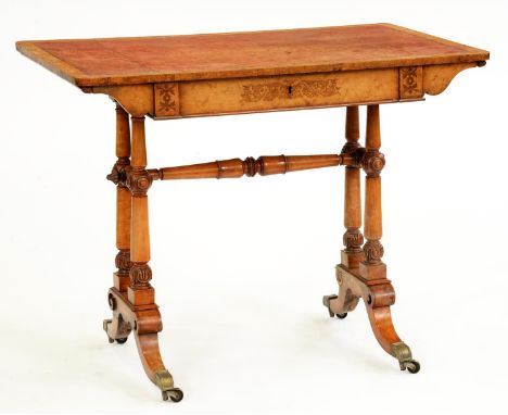 An early Victorian maple, walnut and inlaid writing table, with tooled leather inlet top, the inlaid design possibly based on